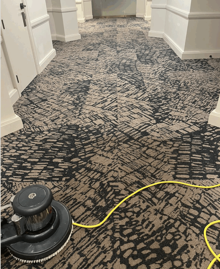 A business wall to wall carpet being cleaned