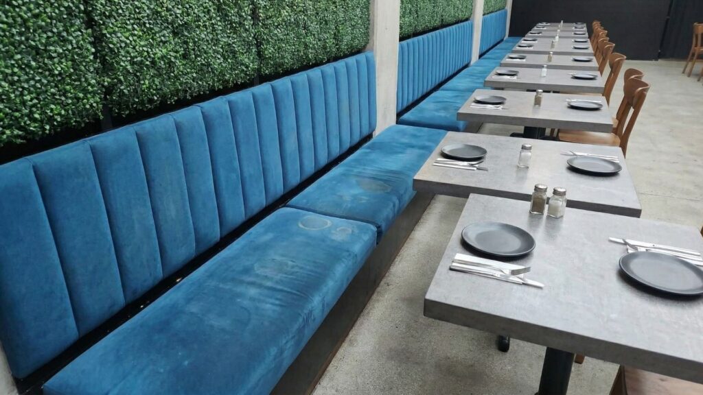 a blue restaurant booth before cleaning | upholstery cleaning . Experts cleaners